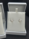 Diamanté bow and pearl earrings